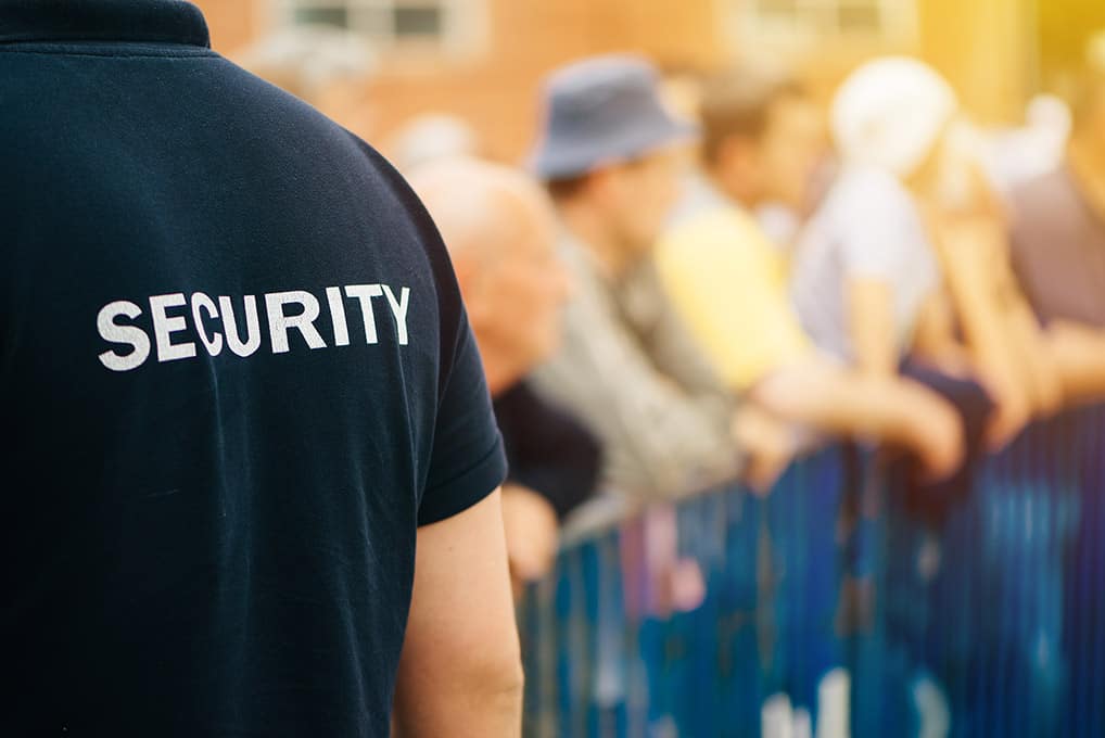 security guard watching over a crowd at an event