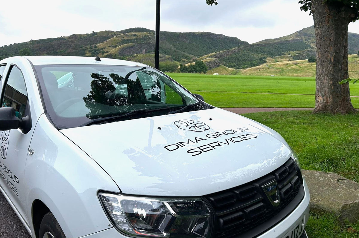 Security-Staff-Solutions-Alarmed-Response car parked infront of arthur seat with DIMA logo