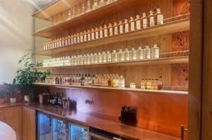 a wall of empty whisky bottles for display