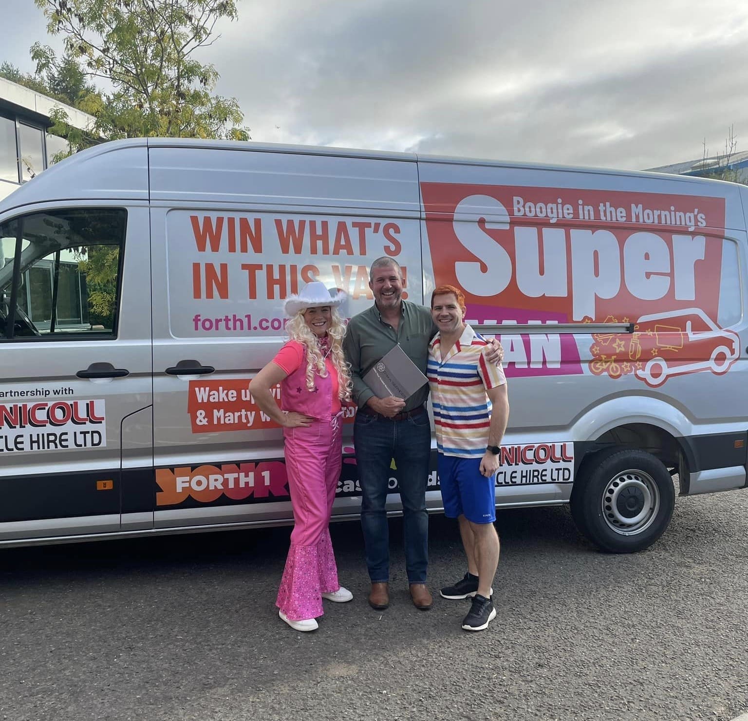 Forth One arlene and marty with the super van for charityand DIMA
