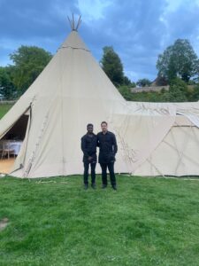 waiting staff at a private wedding outside a marquee